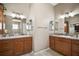 The bathroom showcases double vanities with plenty of counter space and cabinet storage at 1607 Quaker Ct, The Villages, FL 32163