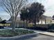 Exterior of the Community Pool house with plenty of parking and manicured landscape at 1607 Quaker Ct, The Villages, FL 32163