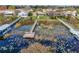 Aerial view of a neighborhood featuring private docks accessing a serene lake, showcasing waterfront living at its finest at 1739 Lake Villa Dr, Tavares, FL 32778