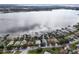 Aerial view of lakeside homes with private docks, offering stunning waterfront living and recreational opportunities at 1739 Lake Villa Dr, Tavares, FL 32778