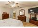 Relaxing bedroom offers a view of the en-suite bathroom and light wood flooring at 1739 Lake Villa Dr, Tavares, FL 32778