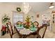 Elegant dining room featuring a chandelier, and setting for six, creating a refined atmosphere at 1739 Lake Villa Dr, Tavares, FL 32778