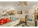 Spacious living room featuring an open layout connecting to the kitchen and dining area at 1739 Lake Villa Dr, Tavares, FL 32778