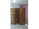 Interior view of a room featuring an intricately carved wooden folding screen room divider at 1846 Fruitland Park Blvd, Fruitland Park, FL 34731