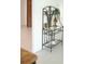 Decorative display shelf with glass and metal accents, perfect for showcasing your favorite items at 1846 Fruitland Park Blvd, Fruitland Park, FL 34731