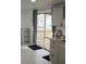 Well-lit kitchen with sliding glass doors to an outdoor patio, ample cabinet space, and modern fixtures at 1846 Fruitland Park Blvd, Fruitland Park, FL 34731
