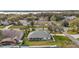 Aerial view of the back of a home with a covered porch and large backyard near a serene neighborhood at 19215 Park Place Blvd, Eustis, FL 32736