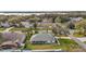 Overhead view of a community with a home featuring a covered back porch and manicured lawn at 19215 Park Place Blvd, Eustis, FL 32736