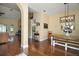 Open-concept living space with hardwood floors and connection to the dining area at 19215 Park Place Blvd, Eustis, FL 32736