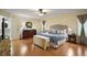 Comfortable bedroom featuring a ceiling fan, hardwood floors, and traditional furnishings at 19215 Park Place Blvd, Eustis, FL 32736