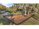 Aerial view of a fenced playground area with swings and equipment, providing a safe and fun space for children at 19215 Park Place Blvd, Eustis, FL 32736