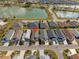 An aerial view of a home with a pond view in a quiet residential neighborhood at 1930 Rhett Rd, The Villages, FL 32163