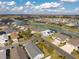 This aerial view showcases the neighborhood's prime location on a canal at 1930 Rhett Rd, The Villages, FL 32163