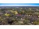 Aerial view of home showcasing the property's pool, landscaping, and surrounding trees at 202 Camino Real Blvd # 202, Howey In The Hills, FL 34737