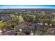 Aerial view of community homes in a golf course setting with lush, mature landscaping at 202 Camino Real Blvd # 202, Howey In The Hills, FL 34737