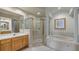 Bathroom featuring a soaking tub, a separate shower, and dual vanities at 202 Camino Real Blvd # 202, Howey In The Hills, FL 34737