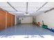 Spacious garage with epoxy flooring, peg board storage and plenty of room for activities at 2041 Park Forest Blvd, Mount Dora, FL 32757