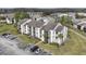 Aerial view of a well-manicured apartment complex with spacious parking and landscaped grounds at 2130 Cascades Blvd # 101, Kissimmee, FL 34741