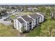 Aerial view of condos showcasing well-maintained landscaping and ample parking at 2130 Cascades Blvd # 101, Kissimmee, FL 34741