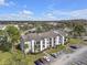 Scenic view of the condos, parking area and lush landscaping at 2130 Cascades Blvd # 101, Kissimmee, FL 34741