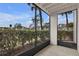 Relaxing screened patio offers a view of lush greenery and ample natural light at 2130 Cascades Blvd # 101, Kissimmee, FL 34741