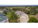 Aerial view of a well-maintained home near a golf course and lake in a residential community at 2190 Derringer Ave, The Villages, FL 32162