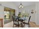 Cozy breakfast nook featuring a glass table, natural light, and sliding door to the lanai at 2190 Derringer Ave, The Villages, FL 32162