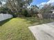 Expansive backyard with a combination of wood and white vinyl fencing for privacy at 2320 Whispering Trails Pl, Winter Haven, FL 33884