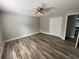 Bedroom featuring wood-look tile floors, a ceiling fan, and a closet at 2320 Whispering Trails Pl, Winter Haven, FL 33884