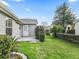 Back yard with a back porch and green grass at 2444 Merida Cir, The Villages, FL 32162