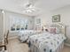 Bright second bedroom with seashell-themed bedding and decor at 2444 Merida Cir, The Villages, FL 32162