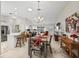 Bright open concept living room and dining area with tile floors and natural light at 2444 Merida Cir, The Villages, FL 32162