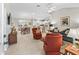 Bright and airy living room showcasing an open floor plan, blending living, dining, and kitchen spaces for modern living at 2444 Merida Cir, The Villages, FL 32162