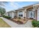 Close-up of the front entrance with arched window and decorative glass door at 24548 Calusa Blvd, Eustis, FL 32736