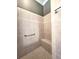 Tiled shower with grab bar and built-in bench at 255 Matisse Ave, The Villages, FL 32162