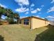 Exterior shot of the back of the home showing siding, windows, and landscaping at 2668 Alandari Ln, The Villages, FL 32162