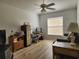 Living Room with laminate wood floor, ceiling fan, window, and furniture at 2668 Alandari Ln, The Villages, FL 32162