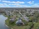 An aerial view of the community highlighting the lakes and neighborhood layout at 27710 Snow Orchid Ct, Leesburg, FL 34748