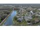 An aerial view of the community highlighting the lakes and neighborhood layout at 27710 Snow Orchid Ct, Leesburg, FL 34748