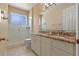 Bathroom featuring granite countertops, a tiled floor, and a glass shower at 27710 Snow Orchid Ct, Leesburg, FL 34748