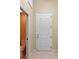 Neutral bathroom with a white panel door at 27710 Snow Orchid Ct, Leesburg, FL 34748