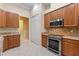 Well-equipped kitchen featuring stainless steel appliances, granite countertops, and ample cabinet space at 27710 Snow Orchid Ct, Leesburg, FL 34748