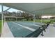 Covered shuffleboard courts offering shade and seating for community fun and recreation at 27710 Snow Orchid Ct, Leesburg, FL 34748