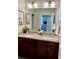 Bathroom with a double sink vanity, granite countertop, and neutral color scheme at 294 Captiva Dr, Davenport, FL 33896