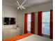 Modern bedroom showcasing minimalist design and colorful curtains at 294 Captiva Dr, Davenport, FL 33896