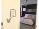 Inviting main bedroom with stylish modern lighting and a cozy bed with plush pillows at 294 Captiva Dr, Davenport, FL 33896