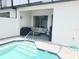Back patio with seating area overlooking private in-ground pool at 294 Captiva Dr, Davenport, FL 33896
