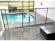 Outdoor pool is surrounded by a safety fence and brick pavers at 294 Captiva Dr, Davenport, FL 33896