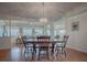 Dining area features a chandelier and an open-concept design at 305 Ranchwood Dr, Leesburg, FL 34748