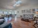 Spacious living room with vaulted ceilings, skylight and open floor plan at 305 Ranchwood Dr, Leesburg, FL 34748